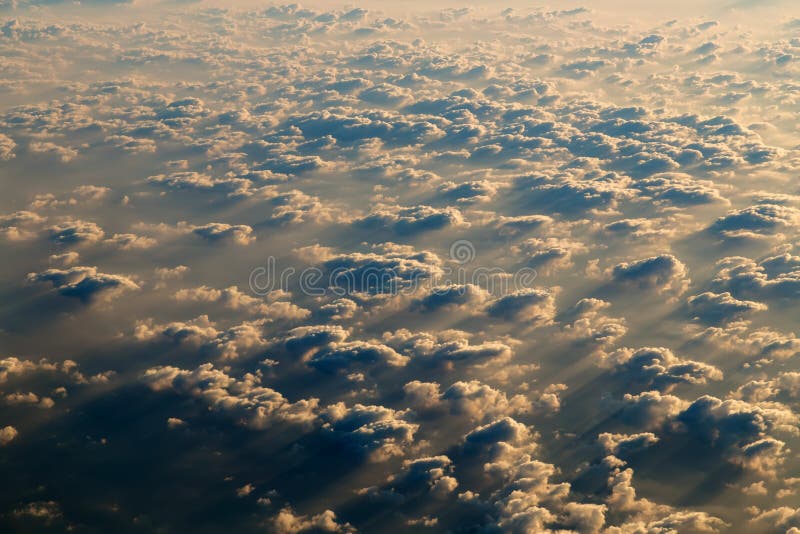 Dramatic Sky scape cloudscape Aerial view of a cloudy sunset in window of airplane flying above clouds nature. Dramatic Sky scape cloudscape Aerial view of a cloudy sunset in window of airplane flying above clouds nature